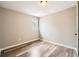 Bedroom with wood-look flooring, neutral walls, and a window providing natural light at 403 Westchester Nw Blvd, Atlanta, GA 30314