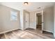 Bedroom featuring wood-look flooring, neutral walls, closet, and bright natural light at 403 Westchester Nw Blvd, Atlanta, GA 30314