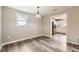 Dining room featuring modern light fixture, neutral paint and wood-look flooring at 403 Westchester Nw Blvd, Atlanta, GA 30314