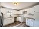 Bright kitchen with granite countertops, white cabinets and stainless steel appliances at 403 Westchester Nw Blvd, Atlanta, GA 30314