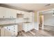 Well-lit kitchen with granite counters, subway tile backsplash and modern wood-look flooring at 403 Westchester Nw Blvd, Atlanta, GA 30314