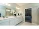 Bathroom featuring a double vanity, large mirror, and shower at 524 Lanier Way, Temple, GA 30179