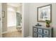 Charming bathroom with a neutral color palette and decorative chest with a framed art piece above at 524 Lanier Way, Temple, GA 30179