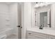 Bathroom showcasing a tub/shower combination and vanity with a white countertop at 897 Porches Way, Dacula, GA 30019