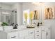 Main bathroom showcasing double vanity, white cabinets, quartz counters, and walk-in shower at 897 Porches Way, Dacula, GA 30019