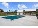 Covered community pool next to pool house and picnic pavilion, surrounded by a black fence at 897 Porches Way, Dacula, GA 30019