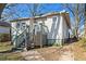 Rear exterior of a home with a deck, stairs, and landscaping at 135 Adair Se Ave, Atlanta, GA 30315