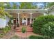 Inviting front porch with brick flooring, rocking chairs, and ample space for relaxation at 6791 Yacht Club Dr, Acworth, GA 30102