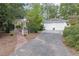 Driveway view of the white two-car garage at 6791 Yacht Club Dr, Acworth, GA 30102