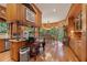 View of the wooden kitchen with stainless steel appliances and dining area at 6791 Yacht Club Dr, Acworth, GA 30102