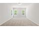 Bedroom with plush carpet, a large window, and lots of natural light at 2769 Porches Ln, Dacula, GA 30019