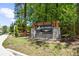 Stone entrance to The Porches at Mobley Lake community with lush surrounding foliage at 2769 Porches Ln, Dacula, GA 30019