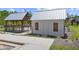 Community pool house with white siding, wood accents, and nearby covered pavilion at 2769 Porches Ln, Dacula, GA 30019