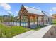 Community pool with fencing, cabana, and sidewalk access to a charming bath house at 2769 Porches Ln, Dacula, GA 30019