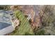 Aerial view of backyard space including an open-air deck and stone-lined walking path at 406 Greyfield Dr, Canton, GA 30115