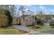 Expansive suburban home displaying its sizable property, curb appeal, and mature landscaping for comfortable living at 406 Greyfield Dr, Canton, GA 30115
