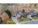 Aerial view of home, showcasing its large lot, landscaped yard, and proximity to other homes, a desirable neighborhood at 406 Greyfield Dr, Canton, GA 30115