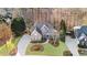 Bird's-eye view of home and neighborhood with long driveway; a picturesque suburban setting at 406 Greyfield Dr, Canton, GA 30115