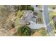 Aerial view of the home showcasing the driveway and professionally landscaped yard at 406 Greyfield Dr, Canton, GA 30115