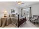 Charming bedroom with a decorative lamp and a cushioned chair at 406 Greyfield Dr, Canton, GA 30115