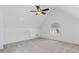 Versatile bonus room featuring vaulted ceiling, arched window and neutral carpeting at 406 Greyfield Dr, Canton, GA 30115