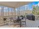 Spacious back deck perfect for outdoor dining with a grill and serene tree view at 406 Greyfield Dr, Canton, GA 30115