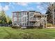 Exterior back of house with large deck and patio overlooking beautiful yard at 406 Greyfield Dr, Canton, GA 30115