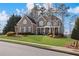 Charming brick home with manicured lawn and covered front porch at 406 Greyfield Dr, Canton, GA 30115