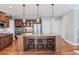 Beautiful kitchen with island seating, wood floors, and stainless steel appliances at 406 Greyfield Dr, Canton, GA 30115