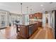 Bright, open kitchen with a granite island, stainless appliances, and a breakfast nook with views of the backyard at 406 Greyfield Dr, Canton, GA 30115