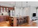 Open kitchen boasts a large island with seating, stainless steel appliances, and ample cabinet space at 406 Greyfield Dr, Canton, GA 30115