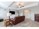 Cozy living room with a leather couch and lots of natural light at 406 Greyfield Dr, Canton, GA 30115