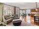 Spacious living area featuring kitchen, fireplace, large windows and comfortable seating for a warm and relaxing atmosphere at 406 Greyfield Dr, Canton, GA 30115