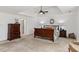 Bright main bedroom with a ceiling fan, trey ceiling, and comfortable furnishings at 406 Greyfield Dr, Canton, GA 30115