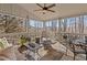 Inviting covered porch with comfortable seating and views of the surrounding trees at 406 Greyfield Dr, Canton, GA 30115