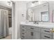 Updated bathroom featuring a spacious vanity with modern fixtures and a shower with stylish tile at 1506 Country Park Se Dr, Smyrna, GA 30080