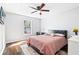 Well-lit bedroom with ceiling fan and soft lighting and a window offering pleasant views at 1506 Country Park Se Dr, Smyrna, GA 30080