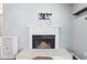 Cozy fireplace with white mantel, marble hearth, and a wall mount for a TV to enjoy in comfort at 1506 Country Park Se Dr, Smyrna, GA 30080