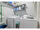 Functional laundry room with ample shelving and modern appliances for convenient chores at 1506 Country Park Se Dr, Smyrna, GA 30080