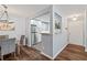 Open floor plan with dining area flowing to kitchen with stainless steel refrigerator and updated features at 1506 Country Park Se Dr, Smyrna, GA 30080