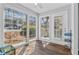 Bright sunroom with large windows offering natural light and serene views at 1506 Country Park Se Dr, Smyrna, GA 30080