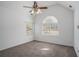 Bright bedroom featuring vaulted ceiling, a ceiling fan, and two windows at 190 The Falls Blvd, Covington, GA 30016