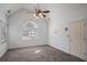 Bright bedroom with a vaulted ceiling, fan, and large window at 190 The Falls Blvd, Covington, GA 30016