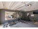 Workout space with weight rack, mirror, rubber floor, and treadmill in this versatile home garage at 190 The Falls Blvd, Covington, GA 30016