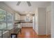Bright kitchen with white cabinets, modern appliances, and large window at 190 The Falls Blvd, Covington, GA 30016