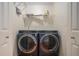 Laundry room featuring a front loading washer and dryer at 190 The Falls Blvd, Covington, GA 30016