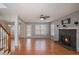 Spacious living room with hardwood floors, fireplace, and bright natural light at 190 The Falls Blvd, Covington, GA 30016