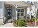 Inviting front porch features cozy seating, decorative plants, and a charming entryway at 2042 Drew Dr, Atlanta, GA 30318