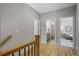 Upstairs hallway with view to the bathroom and another bedroom at 2042 Drew Dr, Atlanta, GA 30318