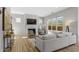 Bright living room with fireplace, light-colored sofa and hardwood floors at 2042 Drew Dr, Atlanta, GA 30318